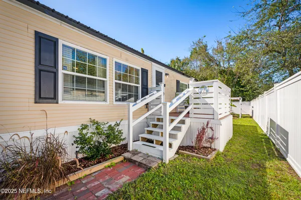 an aerial view of residential house with outdoor space