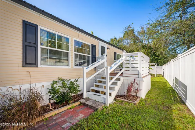 an aerial view of residential house with outdoor space