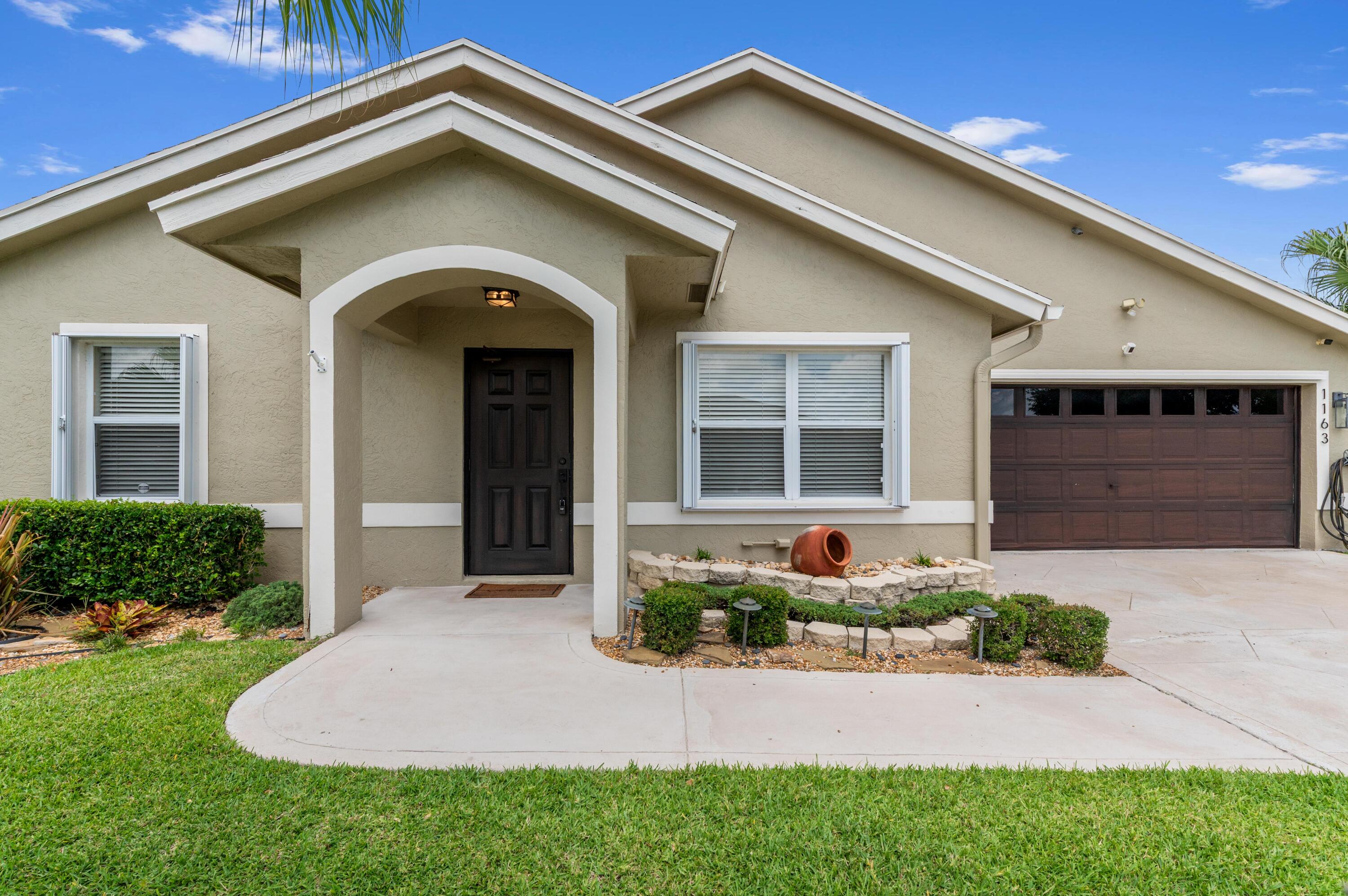 1163 Peninsula Way Greenacres, FL 33413 - Photo 29 of 40 02 Front 02