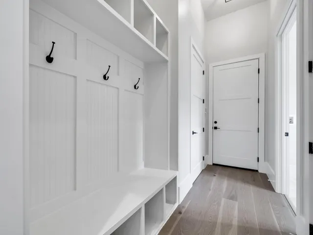 a bathroom with a double vanity sink and mirror