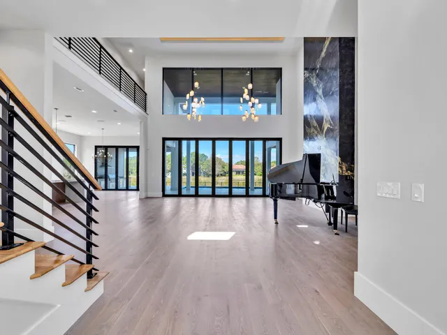 a large kitchen with white cabinets and stainless steel appliances