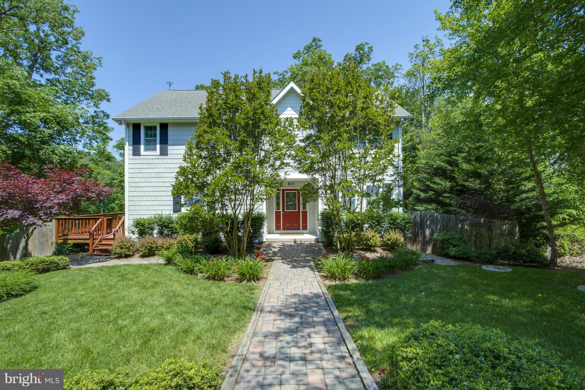 610 Running Fox Road Lusby, MD 20657 - Photo 1 of 30 a front view of a house with garden