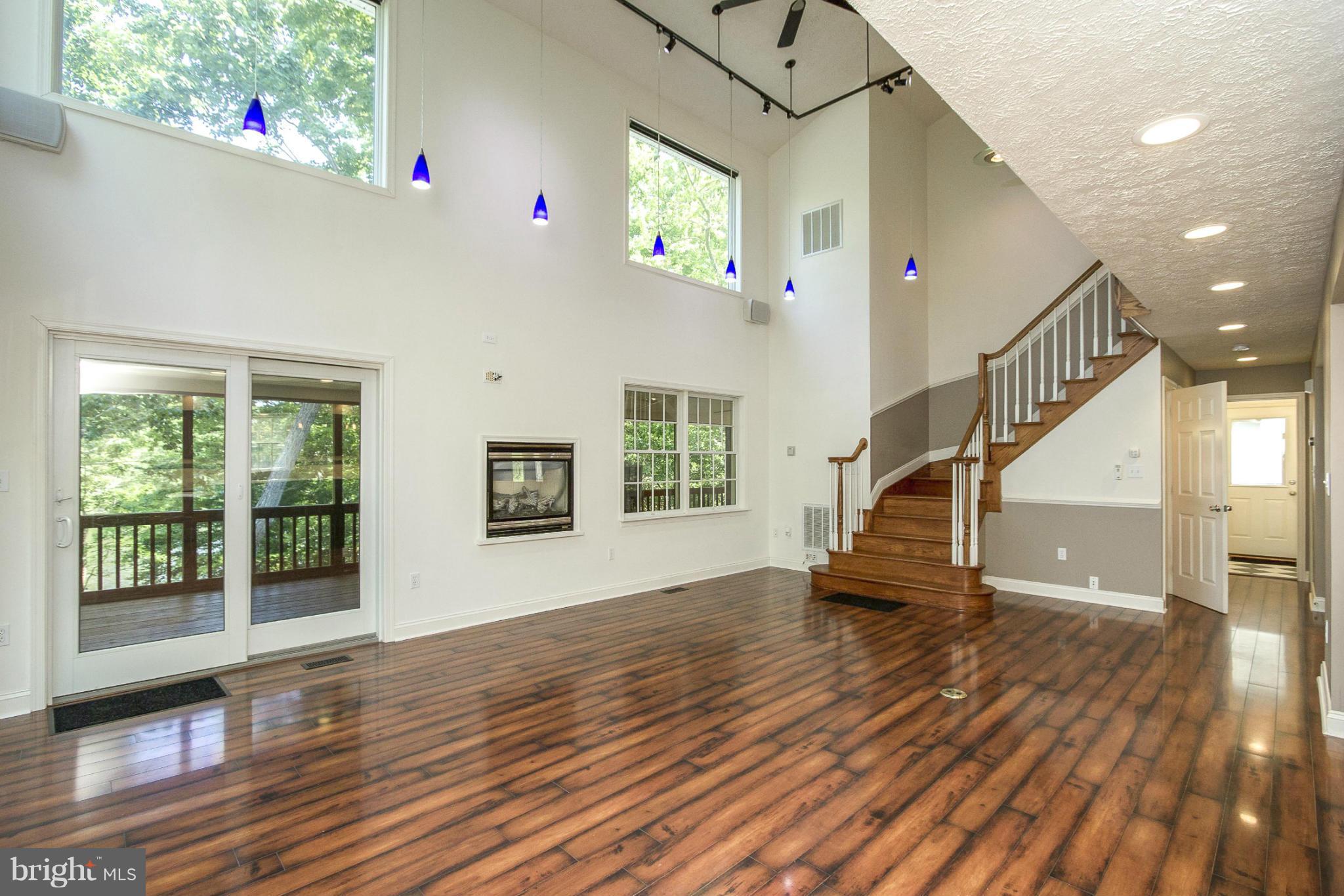610 Running Fox Road Lusby, MD 20657 - Photo 3 of 30 a view of entryway with wooden floor and stairs