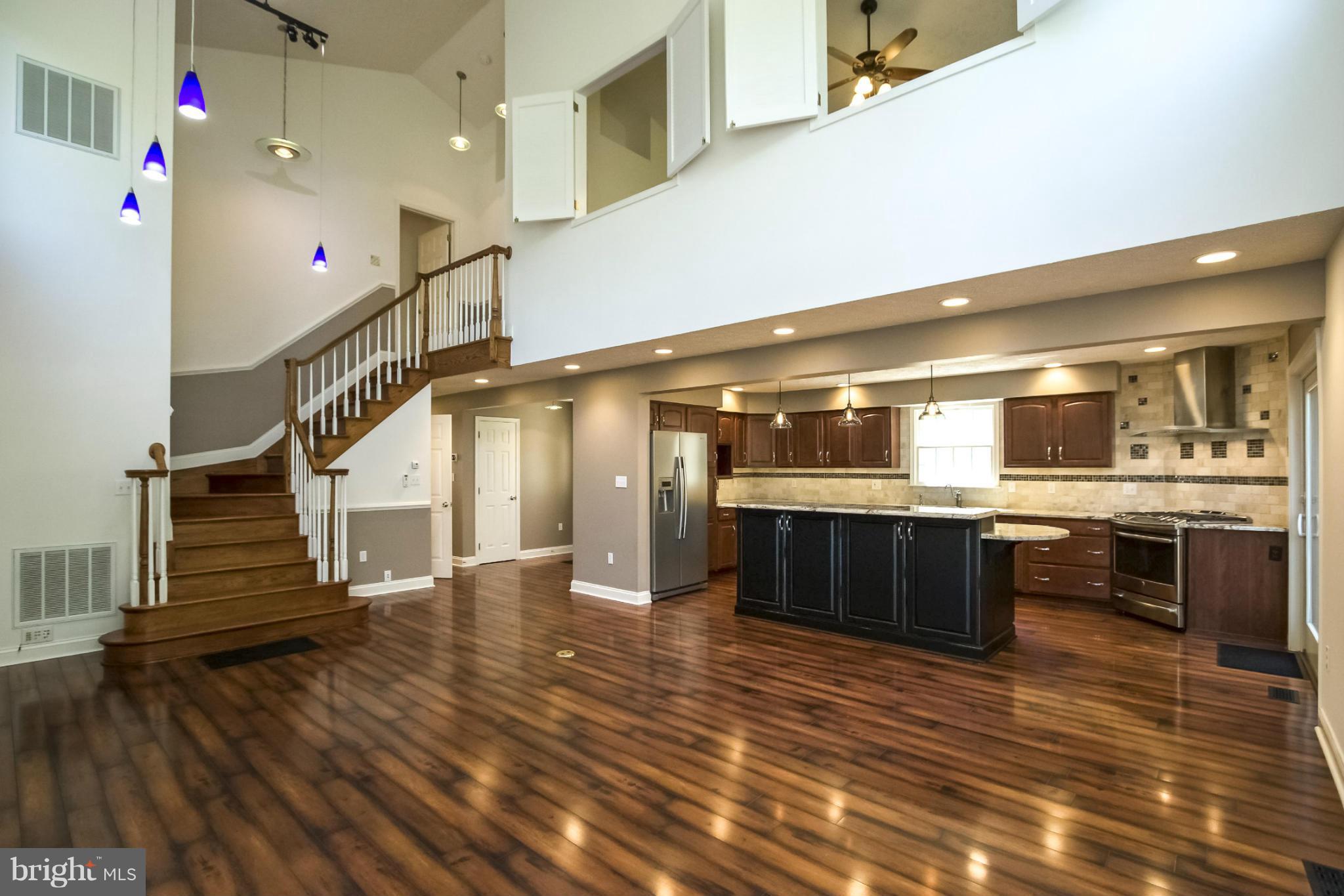 610 Running Fox Road Lusby, MD 20657 - Photo 4 of 30 a lobby with furniture and stairs