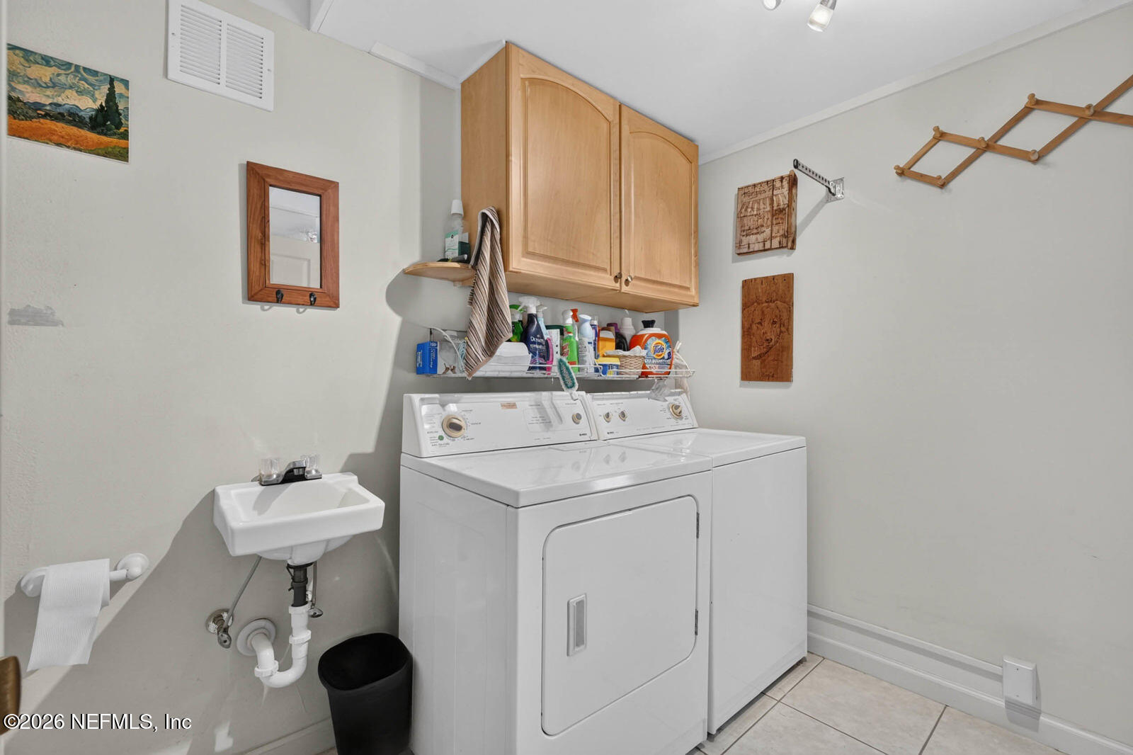 1950 Lightsey Road St. Augustine, FL 32084 - Photo 26 of 57 a bathroom with a sink a toilet and a mirror