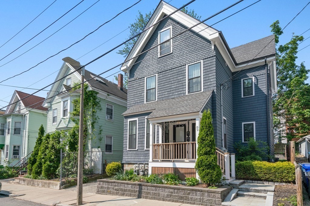 59 Mozart Street, Unit 1 Boston, MA 02130 - Photo 1 of 22 a front view of a house with garden