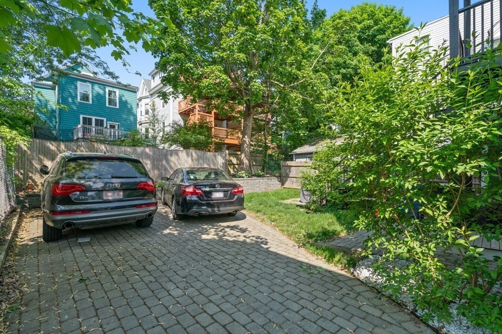 59 Mozart Street, Unit 1 Boston, MA 02130 - Photo 18 of 22 a view of street with parked cars