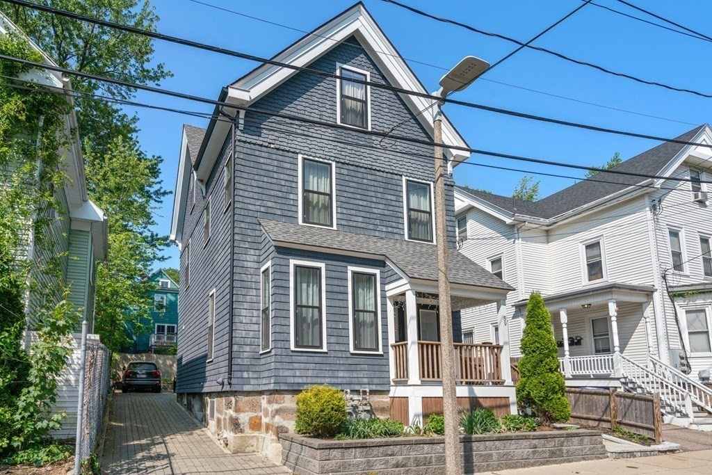 59 Mozart Street, Unit 1 Boston, MA 02130 - Photo 22 of 22 a front view of a house with a yard