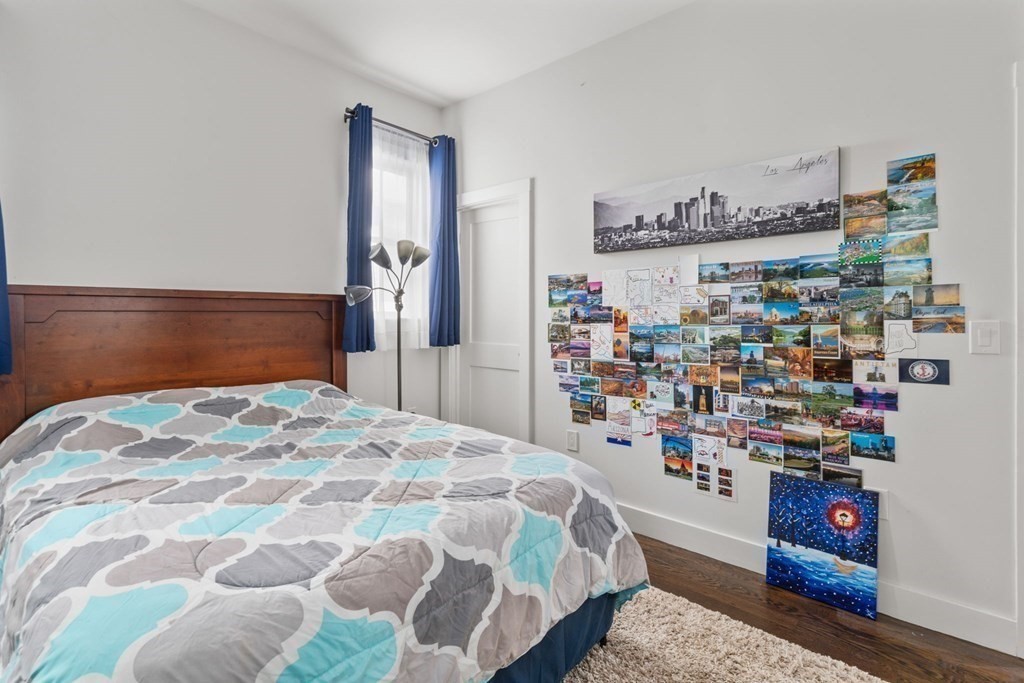 59 Mozart Street, Unit 1 Boston, MA 02130 - Photo 10 of 22 a bedroom with a bed and a window