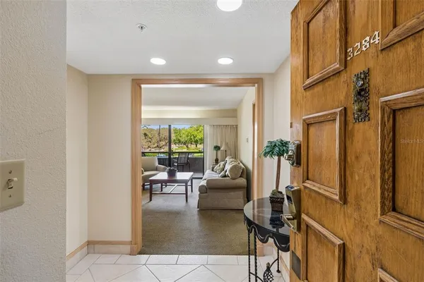 a living room with fireplace furniture and a window