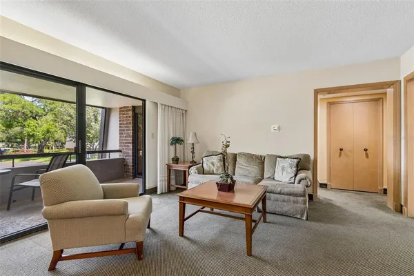 a bedroom with a bed and a night stand