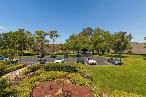 a view of a backyard with sitting area and garden