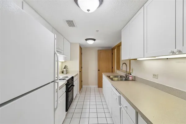 a view of a dining room and livingroom with furniture window and wooden floor