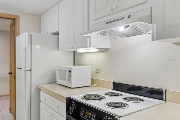 a dining room with furniture and chandelier