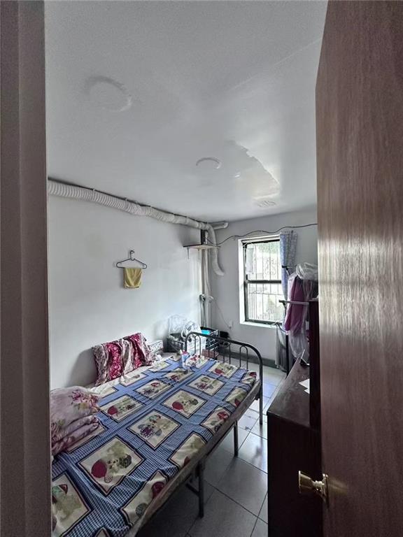 458 58th Street Brooklyn, NY 11220 - Photo 2 of 11 a living room with furniture and a window