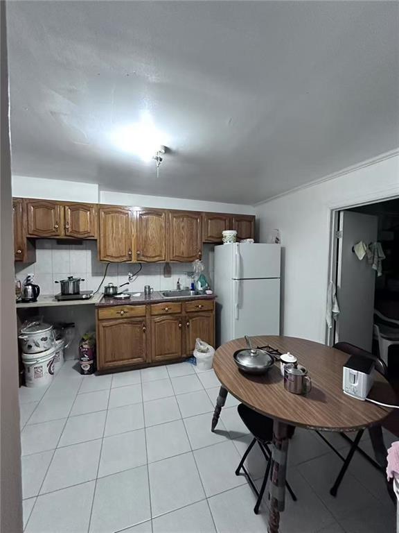 458 58th Street Brooklyn, NY 11220 - Photo 3 of 11 a kitchen with a sink a counter top space and appliances