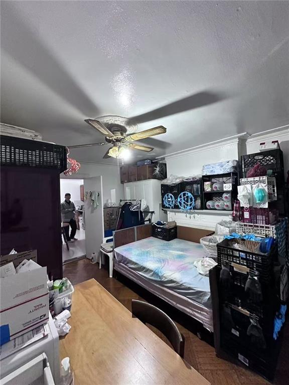 458 58th Street Brooklyn, NY 11220 - Photo 4 of 11 a living room with furniture and a flat screen tv