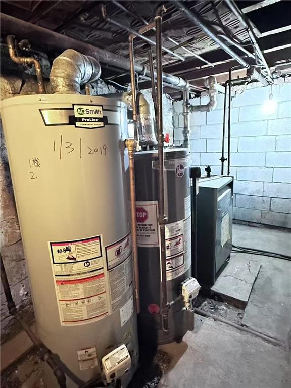 458 58th Street Brooklyn, NY 11220 - Photo 6 of 11 a view of a storage room with washer and dryer
