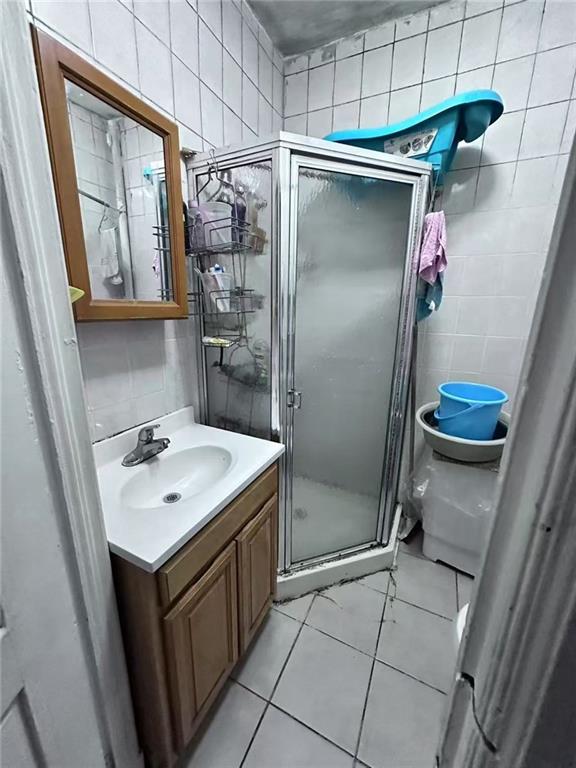 458 58th Street Brooklyn, NY 11220 - Photo 10 of 11 a bathroom with a sink toilet and shower