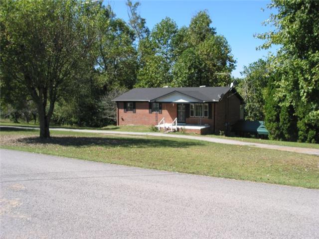 Front of house from across the road. Note circular driveway!