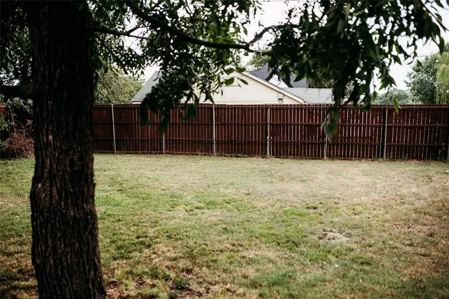 a view of backyard with green space