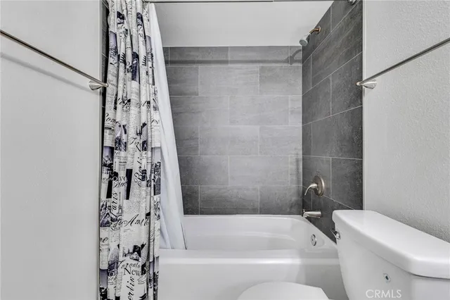 a bathroom with a bathtub and shower