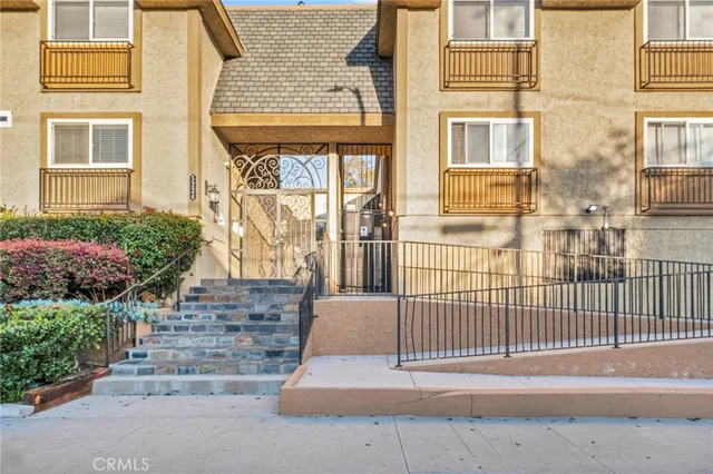 a front view of a building with garden