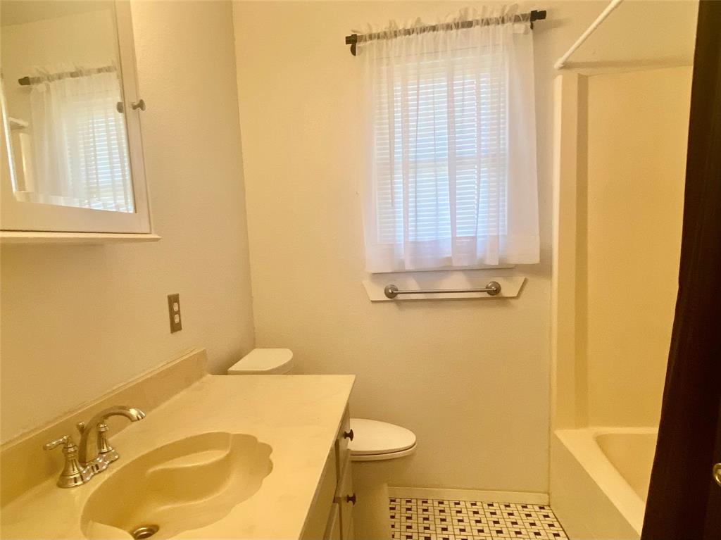 2506 Fm 272 Celeste, TX 75423 - Photo 13 of 36 a bathroom with a granite countertop sink and a mirror
