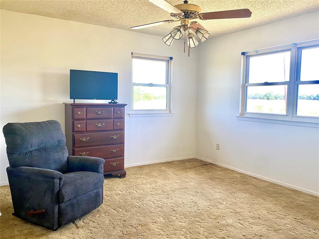 2506 Fm 272 Celeste, TX 75423 - Photo 15 of 36 a living room with furniture a flat screen tv and a window