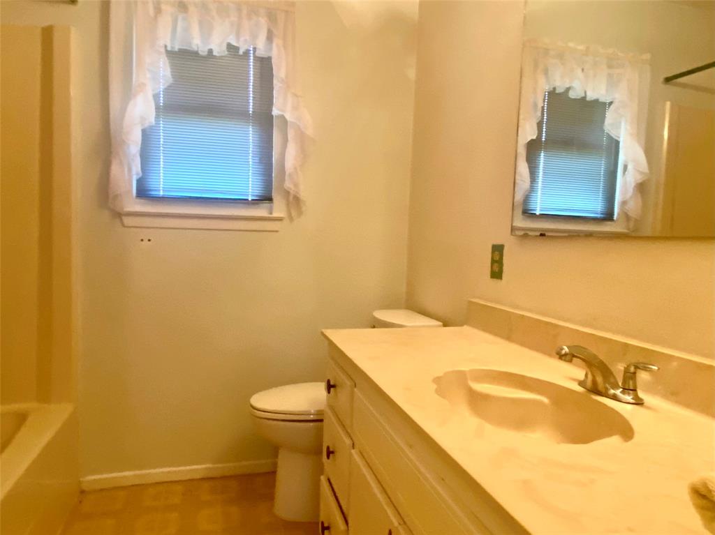 2506 Fm 272 Celeste, TX 75423 - Photo 17 of 36 a bathroom with a sink and a mirror