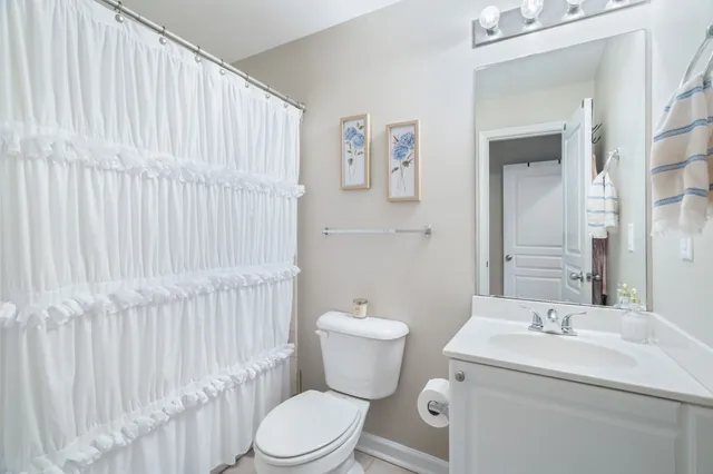 a view of walk in closet with clothes