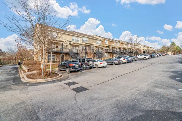 a view of parking with cars parked