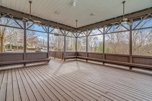 a view of a swimming pool with an outdoor seating and a yard