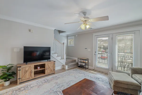 a living room with furniture and a flat screen tv