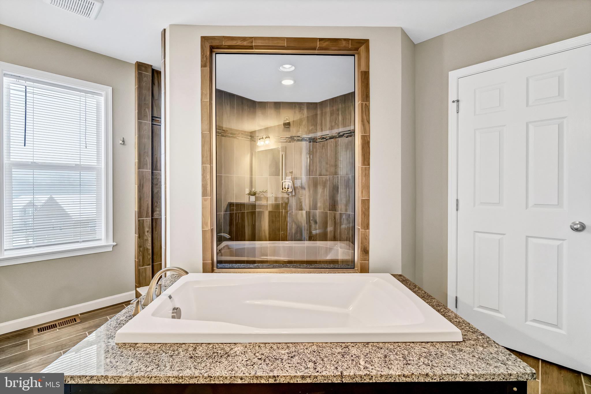 283 Henderson Road Bel Air, MD 21014 - Photo 32 of 47 Soaking tub with double shower behind it