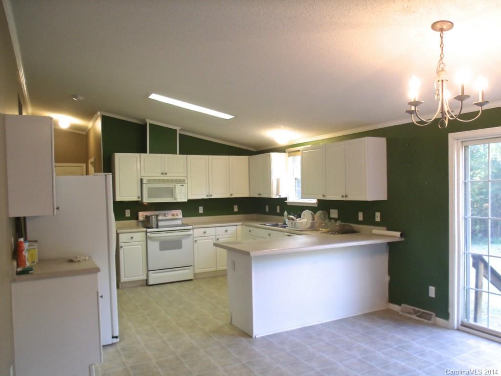 8333 Smith Road, Unit 5 88AC Kannapolis, NC 28081 - Photo 3 of 24 a kitchen with a sink cabinets and window