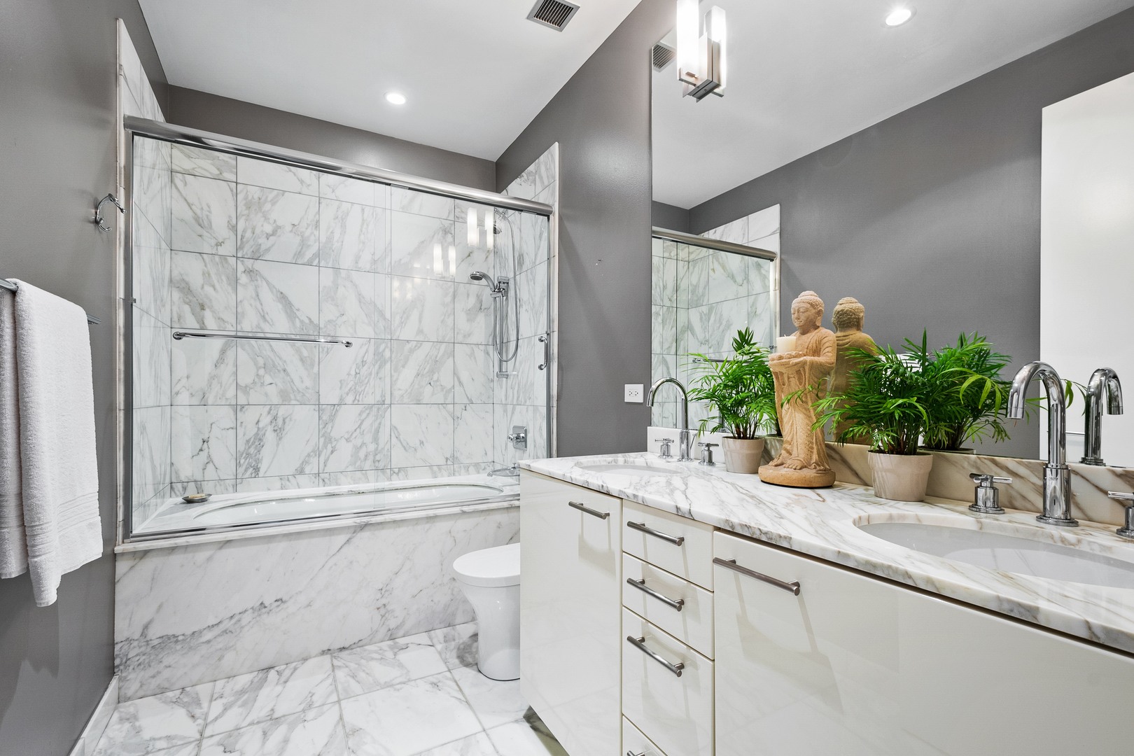 30 West Oak Street, Unit 5E Chicago, IL 60610 - Photo 14 of 22 a bathroom with a granite countertop sink a toilet and shower