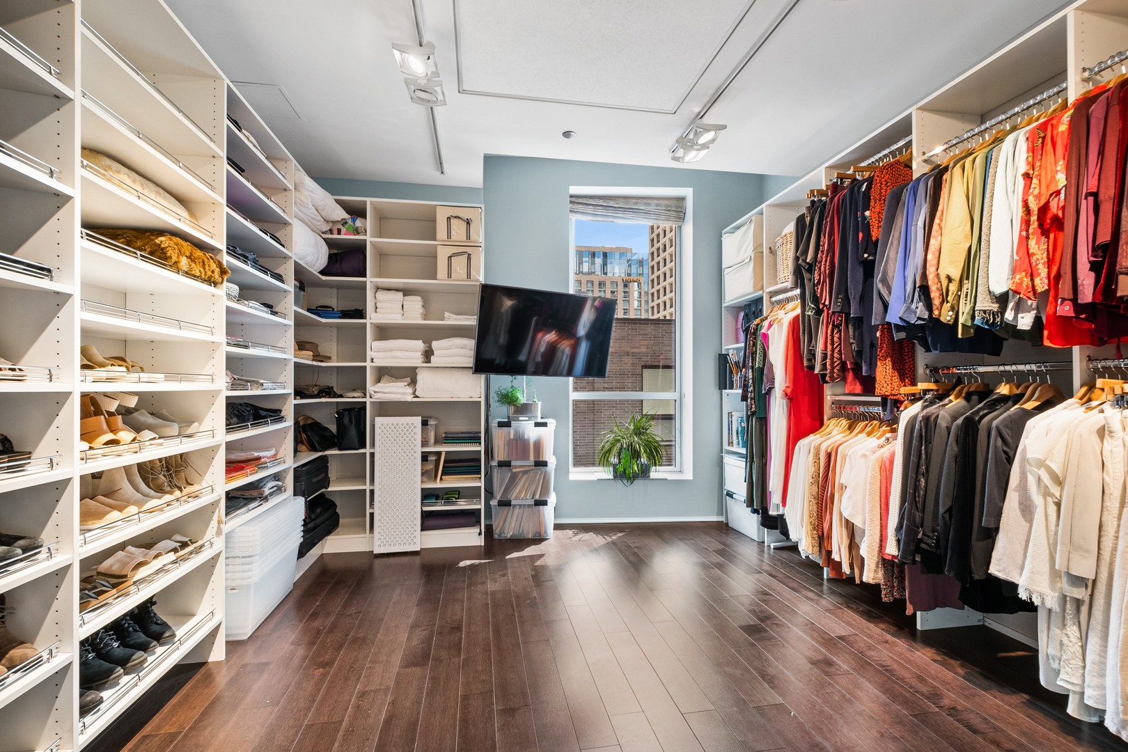 30 West Oak Street, Unit 5E Chicago, IL 60610 - Photo 15 of 22 a view of walk in closet with clothes and shoes