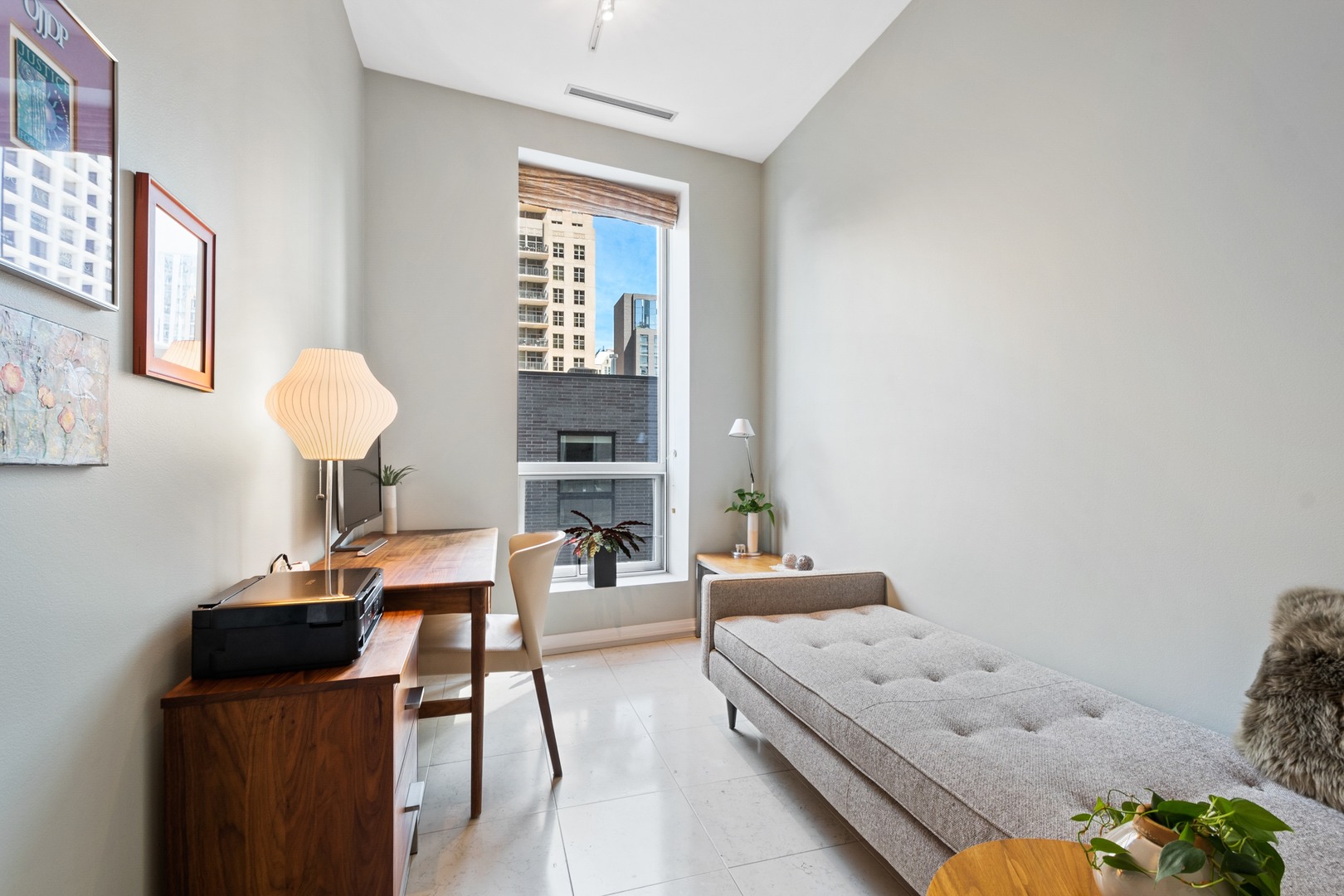 30 West Oak Street, Unit 5E Chicago, IL 60610 - Photo 17 of 22 a living room with furniture and a window