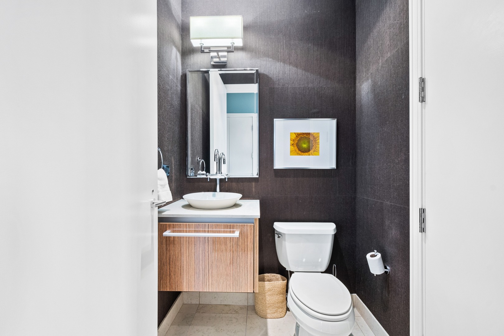 30 West Oak Street, Unit 5E Chicago, IL 60610 - Photo 18 of 22 a bathroom with a toilet a sink and mirror