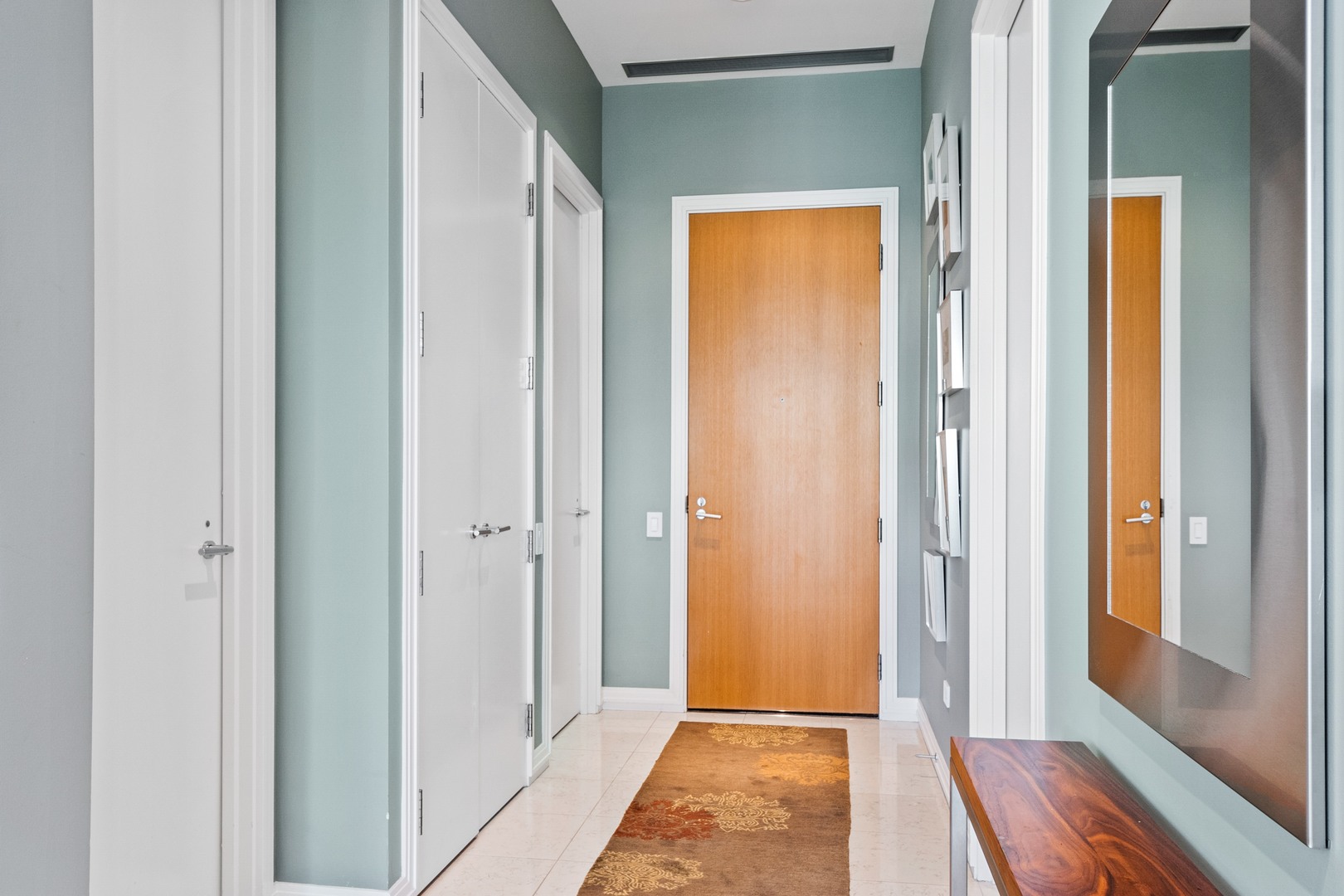 30 West Oak Street, Unit 5E Chicago, IL 60610 - Photo 19 of 22 a view of a bathroom with a door and a window