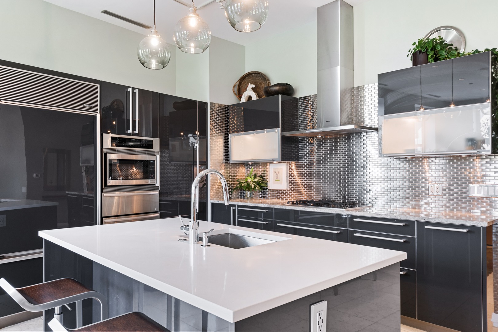 30 West Oak Street, Unit 5E Chicago, IL 60610 - Photo 9 of 22 a kitchen with stainless steel appliances a sink and a refrigerator