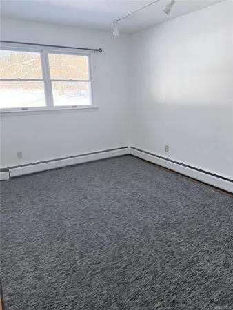 a bathroom with a sink and glass door