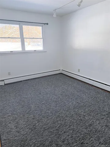 a bathroom with a sink and glass door