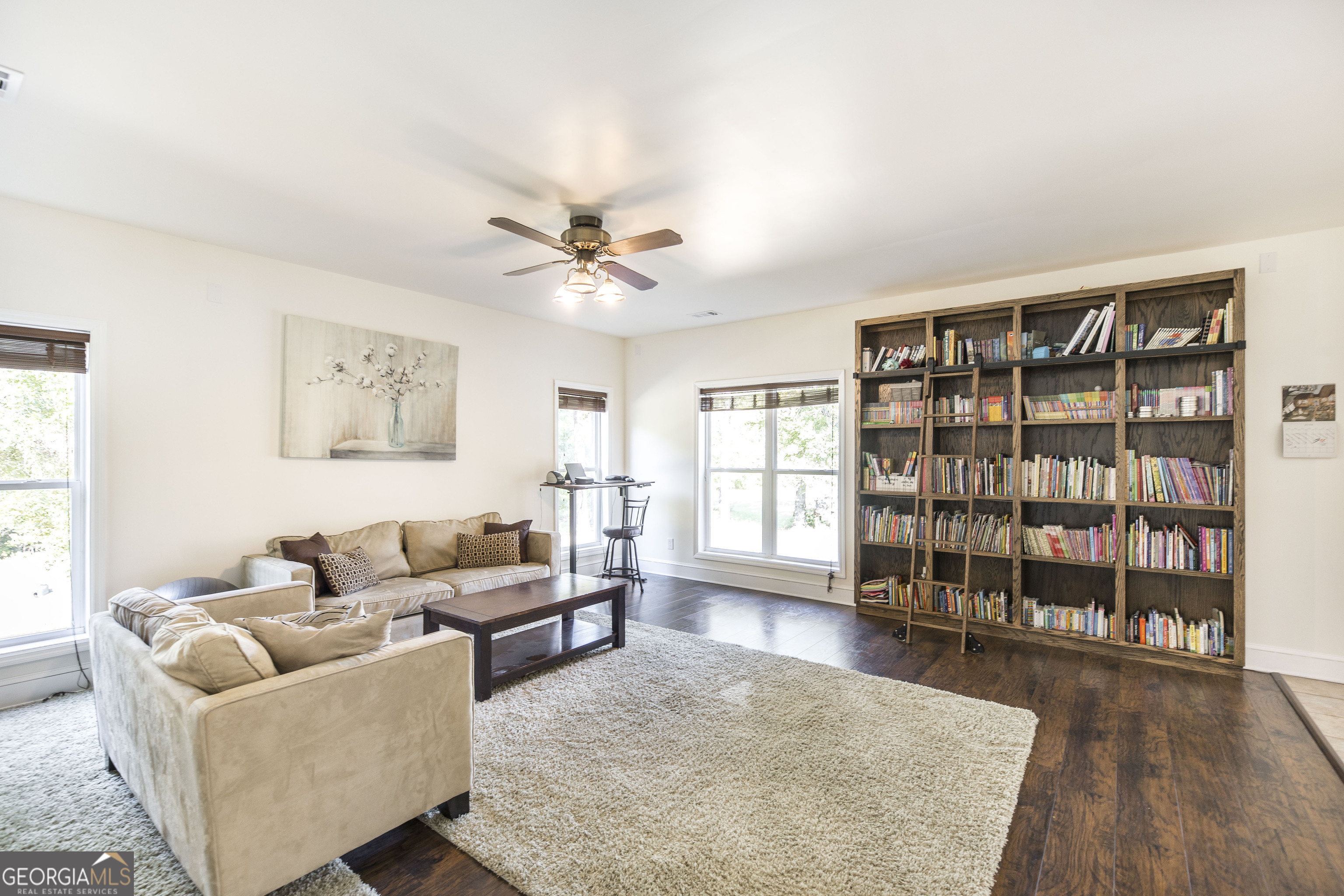 1979 Dent Road Musella, GA 31066 - Photo 14 of 77 a living room with furniture and a book shelf