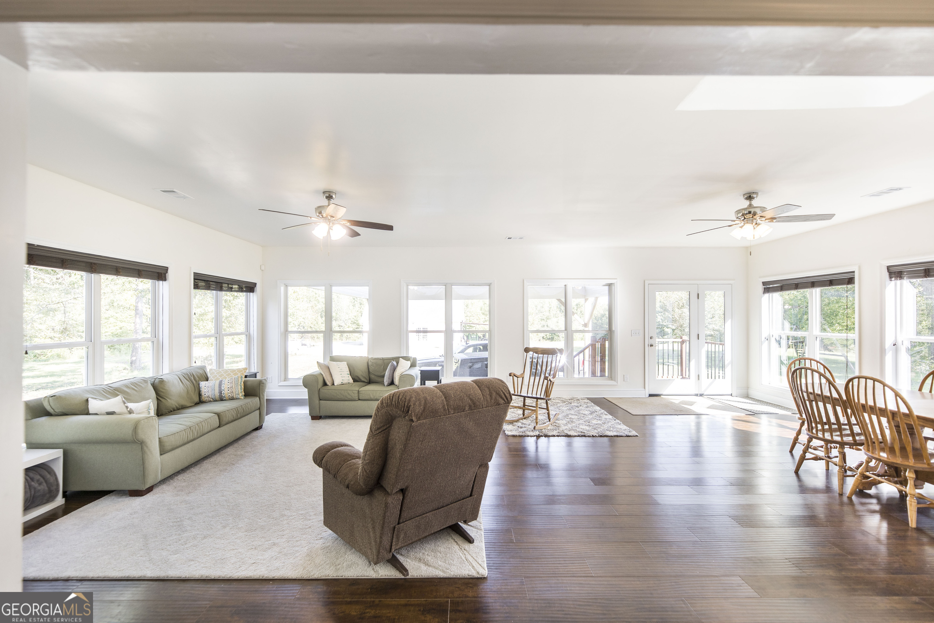 1979 Dent Road Musella, GA 31066 - Photo 16 of 77 a living room with furniture wooden floor and a large window