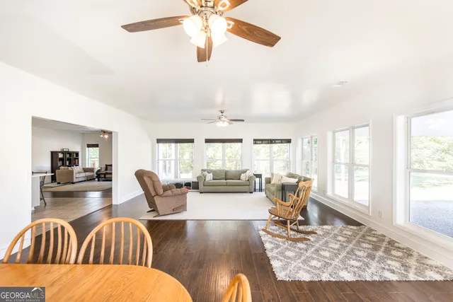 a bathroom with a tub a sink and a window