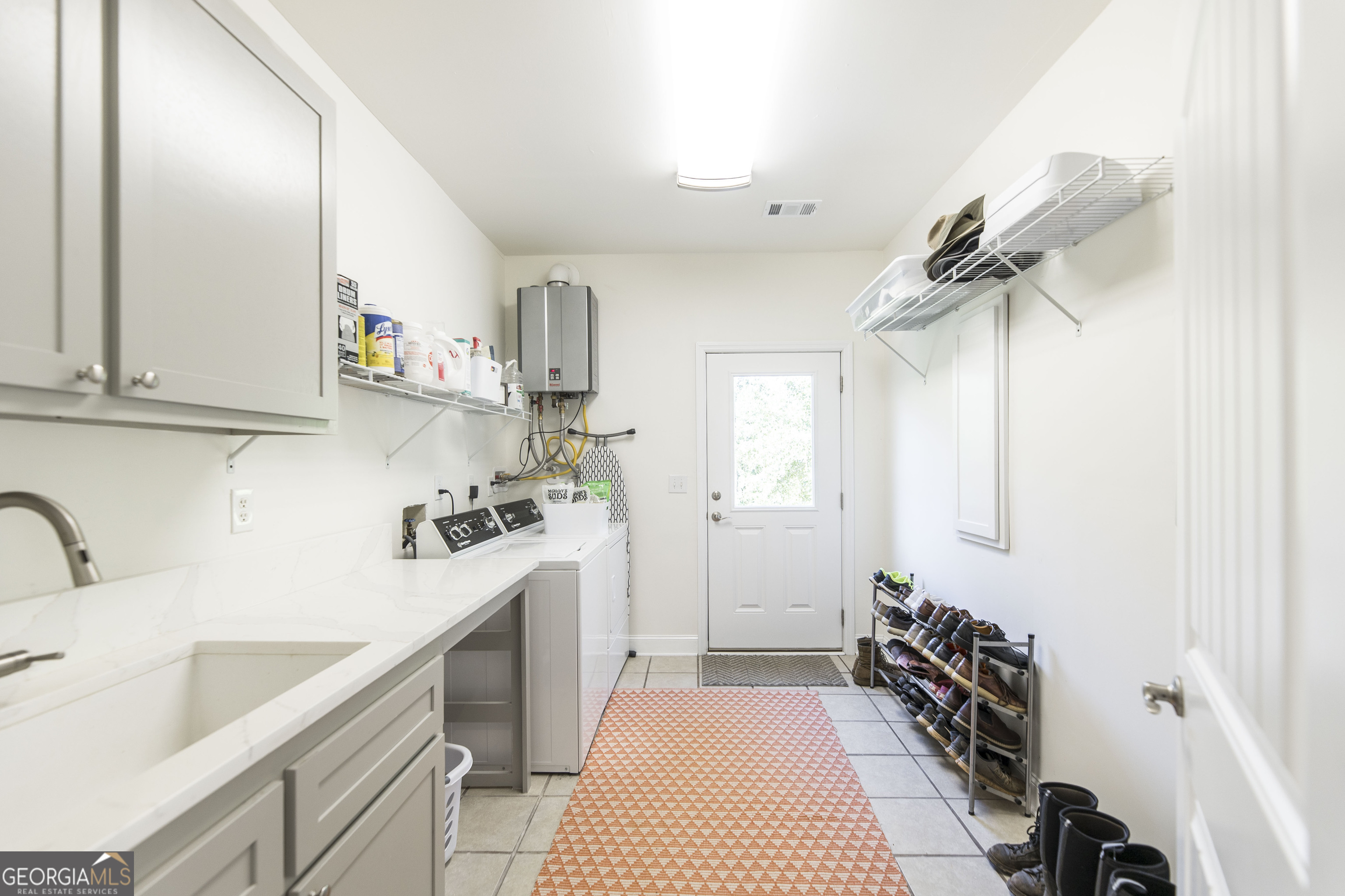 1979 Dent Road Musella, GA 31066 - Photo 20 of 77 a kitchen with a sink stove and cabinets