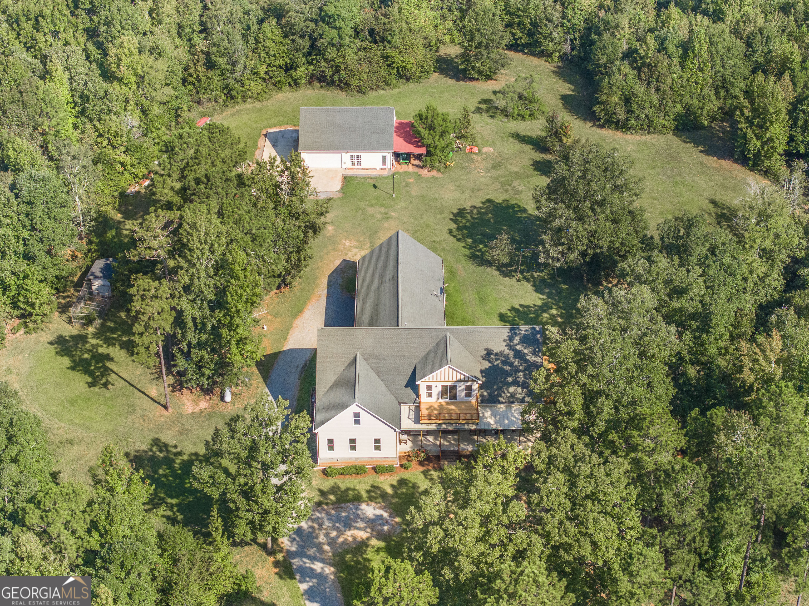 1979 Dent Road Musella, GA 31066 - Photo 2 of 77 an aerial view of house with yard and trees in the background