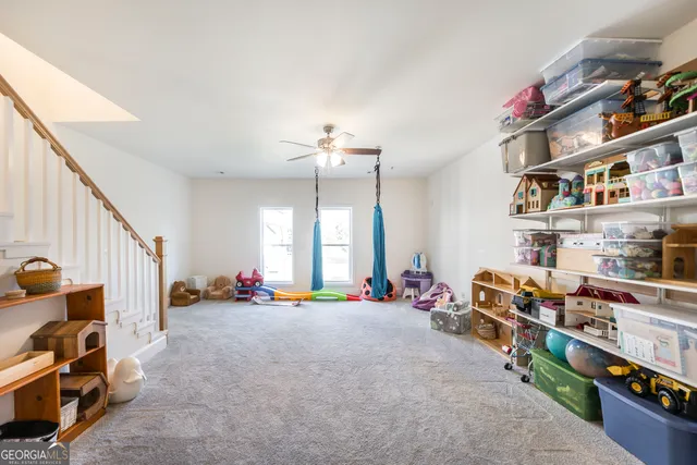 a view of cabinets a sink and dishwasher with wooden floor